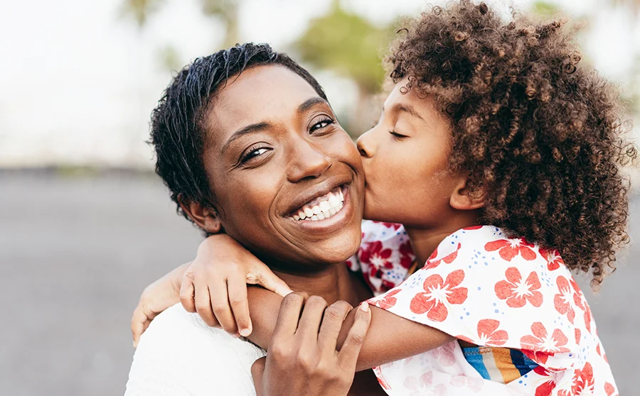 Happy young mother and daughter