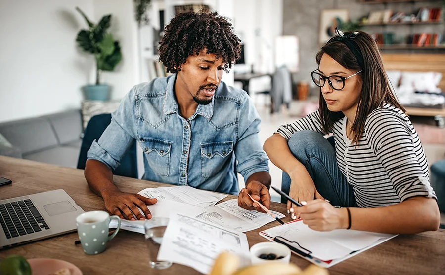 Couple at a desk paying bills