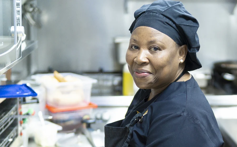 Hospital cook preparing food for patients