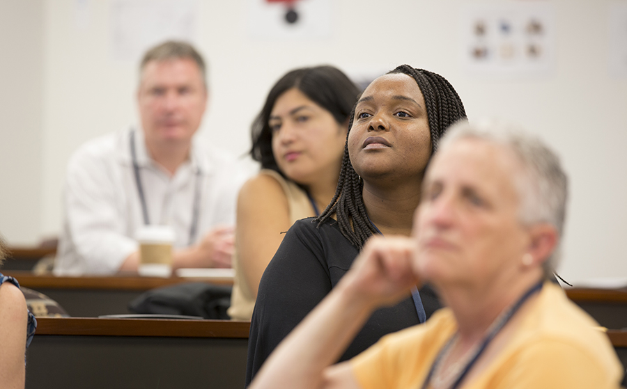 People in a classroom listening to speaker